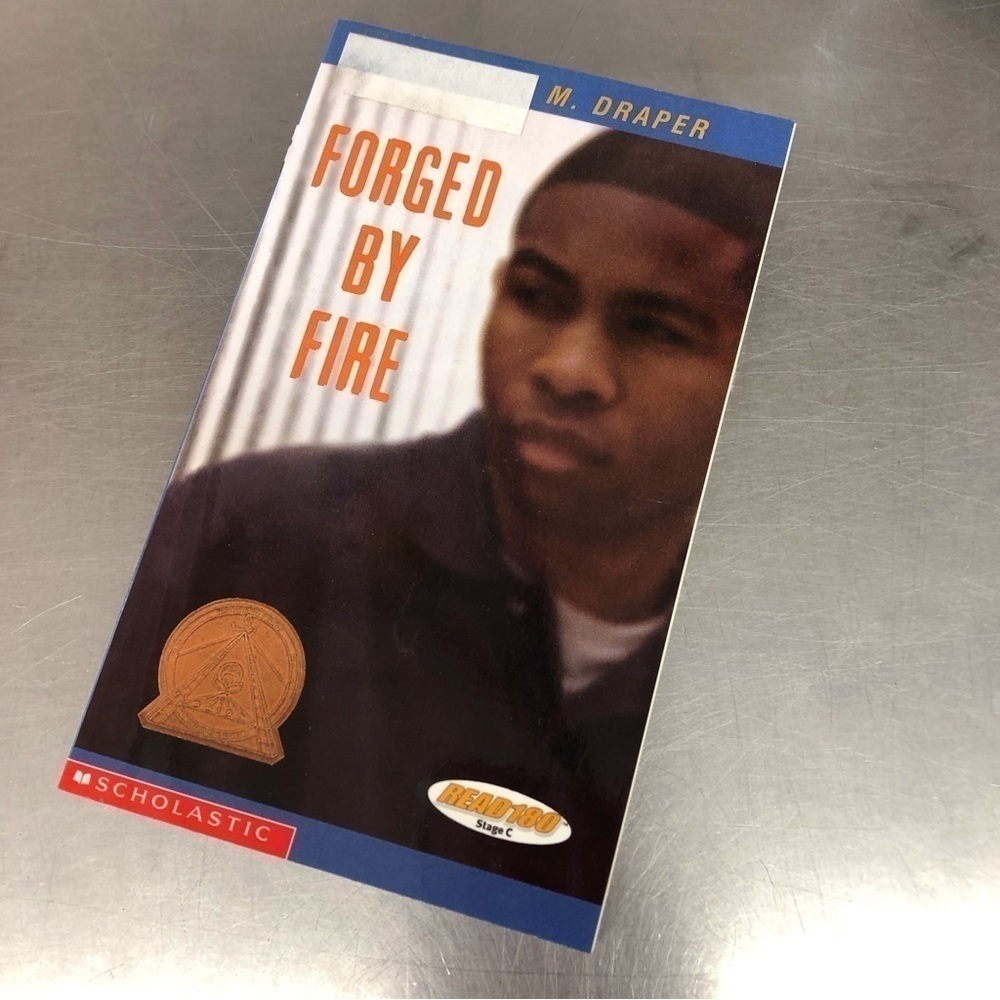 Forged by Fire by: Sharon M. Draper, paperback book